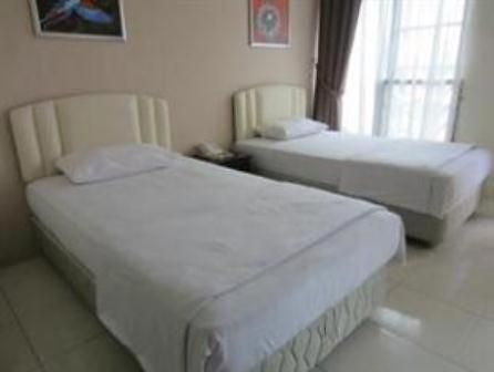 Mendu Inn Kuching Rum bild