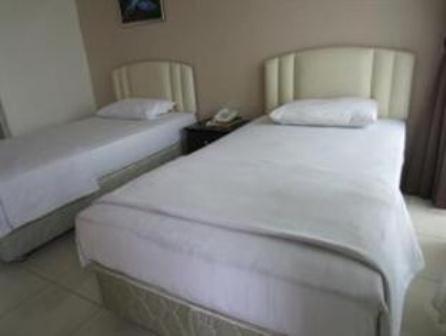 Mendu Inn Kuching Rum bild